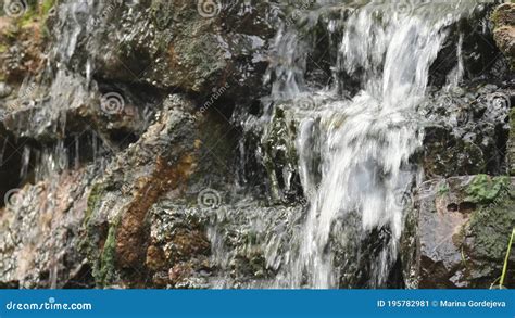 The Small Cascade Waterfall Up Close Shot Of Water Trickling Over