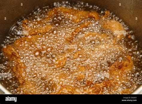 Chicken Being Deep Fried In Hot Oil Stock Photo Alamy