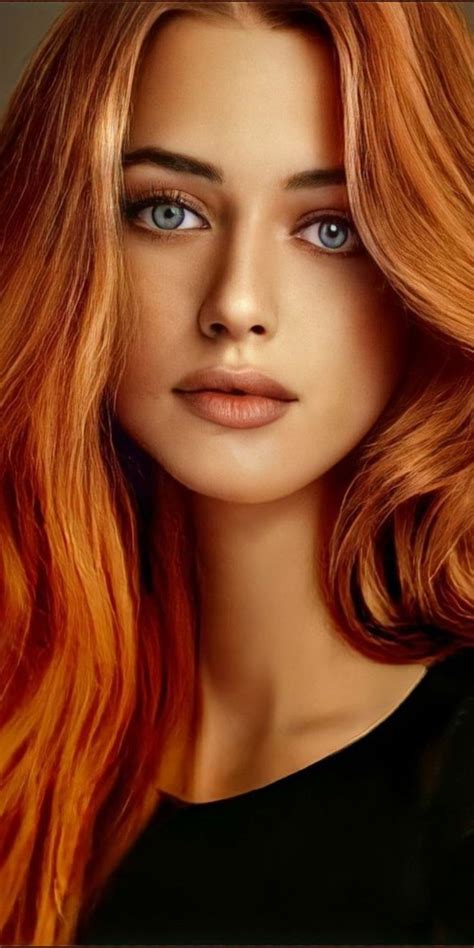 A Woman With Long Red Hair And Blue Eyes Is Shown In This Artistic