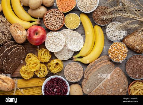 Rich On Carbohydrates Food With Wholegrain Bread And Fruits Stock Photo