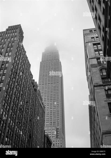 Empire State Building In New York City Shrouded In Fog Black And White