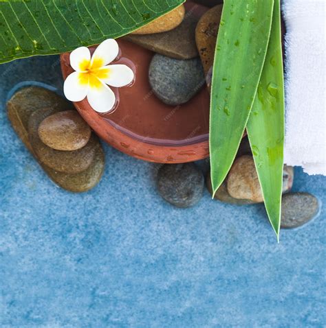 Premium Photo Top View Of Spa Objects And Stones For Massage Treatment On Blue Marble Background