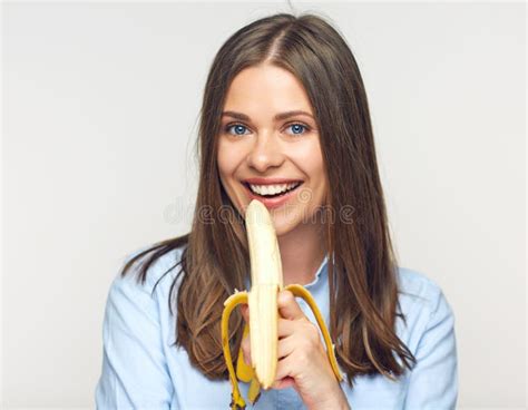 Smiling Woman Eating Peeled Banana. Stock Photo - Image of businesswoman, people: 130872678