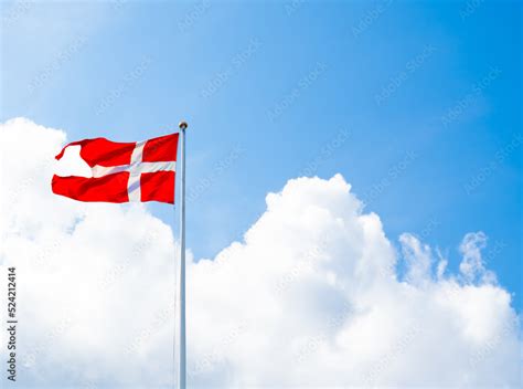 Danish National flag, Dannebrog on a flagpole. Stock Photo | Adobe Stock