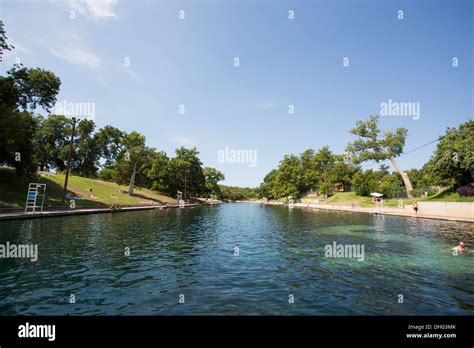 People Swim In The Outdoor Swimming Pool At Barton Springs Pool In