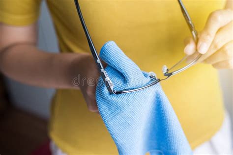 Hand Woman Cleaning Her Glasses With Microfiber Clothclean Lenses Of Eyeglasses Stock Image