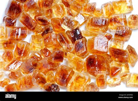 Some Brown Sugar Crystals On White Background Stock Photo Alamy