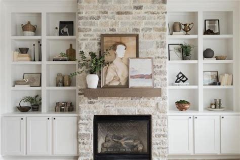 A Living Room Filled With Furniture And A Fire Place Under A Flat