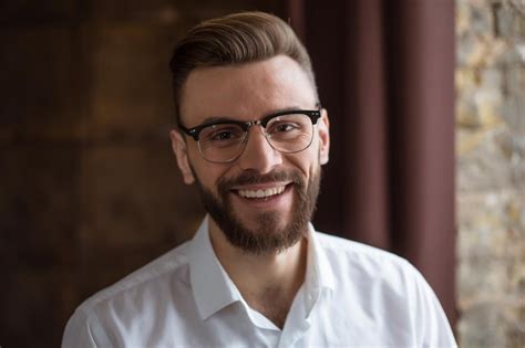 Premium Photo Young Smiling Handsome Bearded Businessman In A White