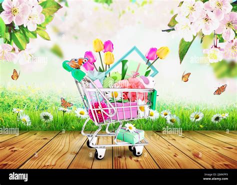 Mini Shopping Cart With Colorful Flowers And Butterflies Stock Photo