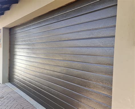 Double Bronze Slatted Aluzinc Garage Door Nu Ray Doors