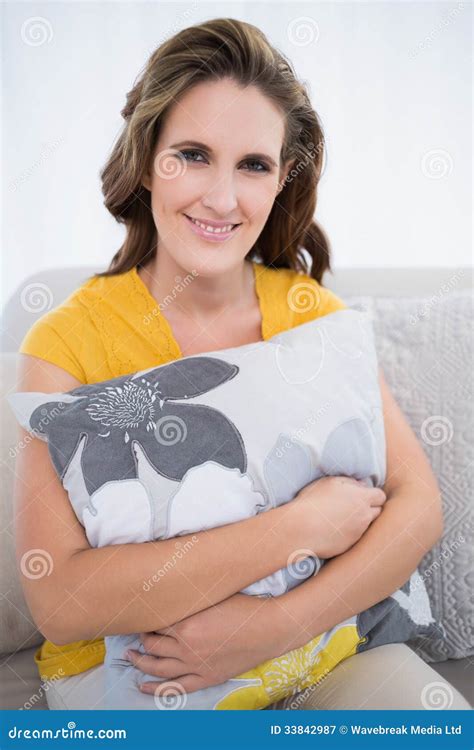 Happy Woman Sitting On Sofa Holding Pillow Stock Image Image Of Sofa