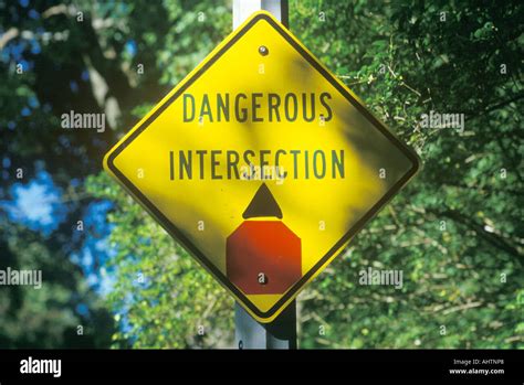 A dangerous intersection road sign Stock Photo - Alamy