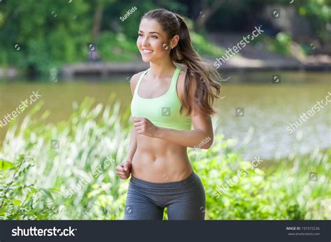 Female Fitness Model Running Outdoors Stock Photo 197472236 | Shutterstock