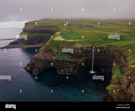 Beautiful Aerial View Of Gasadalur Waterfall And Village And Landscapes