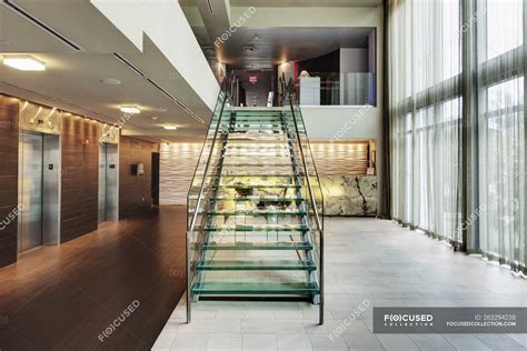 Glass staircase in luxury hotel lobby — ostentatious, lift - Stock ...