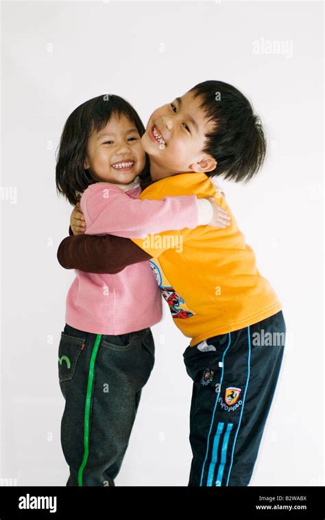 Young Brother And Sister Hugging Stock Photo - Alamy