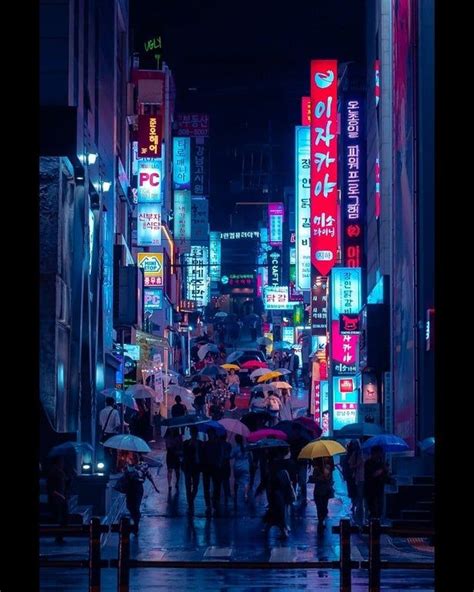 Rain Drenched Street At Night Full Of Umbrellas Gangnam District