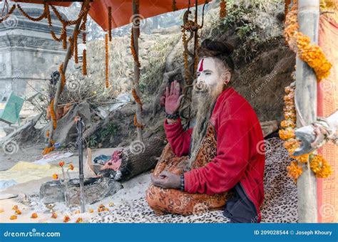 Sadhu Posing For Devotees During The Traditional Hindu Festival Maha