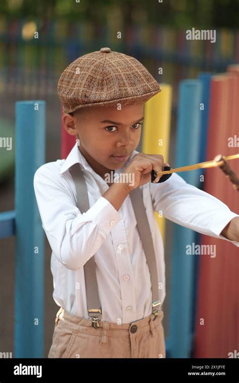 A Boy With A Slingshot Stock Photo Alamy