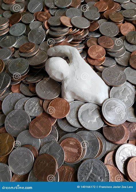 Figure Of A Person Swimming In Money Made With White Clay And