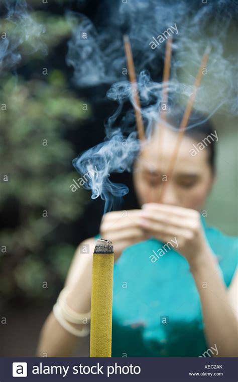 Incense Woman Hold High Resolution Stock Photography And Images Alamy