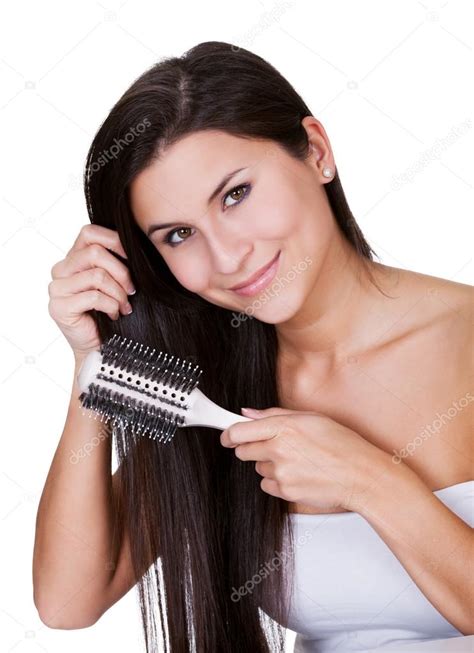 Smiling Woman Brushing Long Brunette Hair Stock Photo AndreyPopov