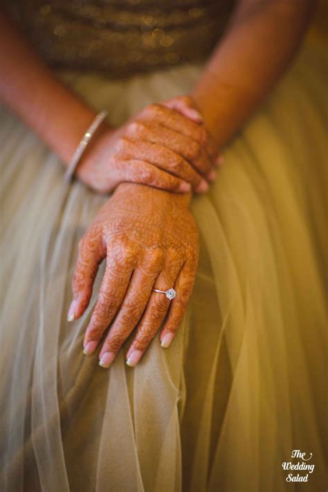 Photo Of Bridal Hands With Engagement Ring And Mehendi