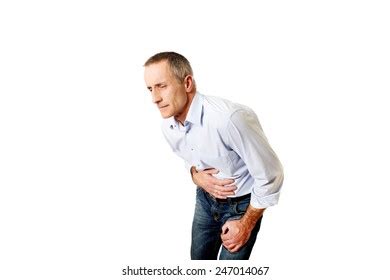 Full Length Mature Man Suffering Stomachache Stock Photo