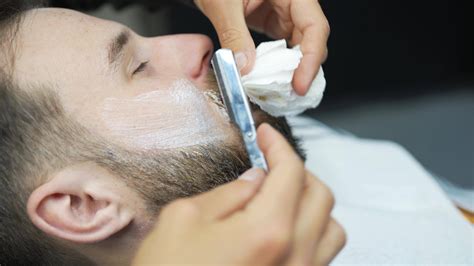 Barber Uses Straight Razor To Shave Man S Neck And Face To Shape Facial