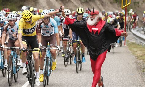 This Is Why Tour De France Cyclists Are High Fiving A Man Dressed As