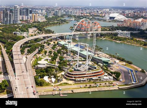 High View Of Singapore Skyline With The Singapore Flyer Ferris Wheel