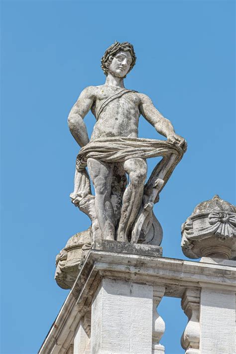 Roof Statue Of A Beautiful Renaissance Era Naked Woman At Old Library