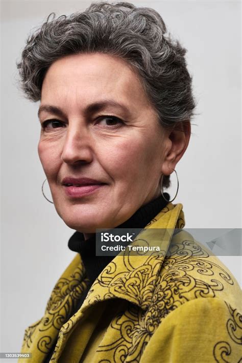 fashionable middleaged woman    camera stock photo