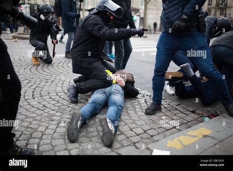 Protester Arrested By Police Forces At The Arc De Triomphe During Anti