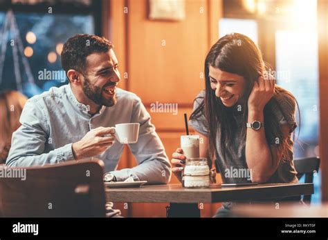 Romantic Loving Couple Drinking Coffee Having A Date In The Cafe Stock