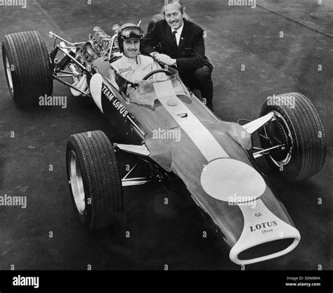 Graham Hill And Colin Chapman With Lotus 49 1967 Artist Unknown