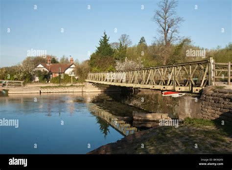 Wooden Footbridge Over The River Thames At Bossoms Boatyard In Port