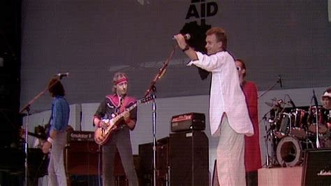 ‎Money for Nothing (Live at Live Aid, Wembley Stadium, 13th July 1985) - Music Video by Dire ...