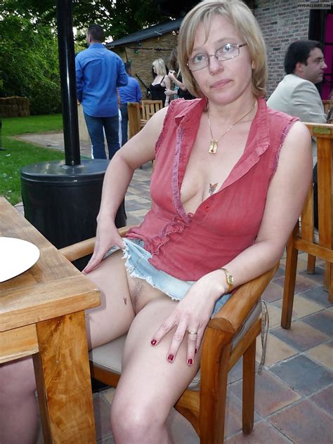 Milf In A Short Skirt And Showing Her Bottomless Pussy