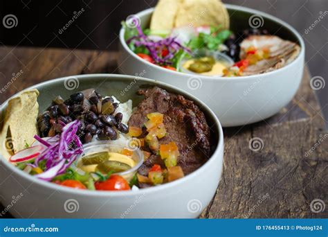 Protein Bowl Of Grilled Striploin Pilaf Rice Beans Guacamole Homemade Spiced Cheese Sauce