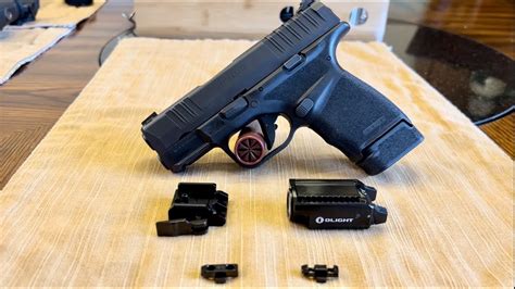 Springfield Hellcat With Olight PL Mini 2 And MIE Productions Holster