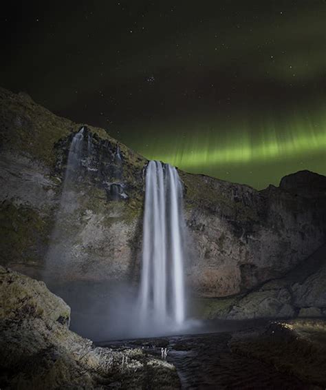 Seljalandsfoss surrounded with Northern lights | Guide to Iceland