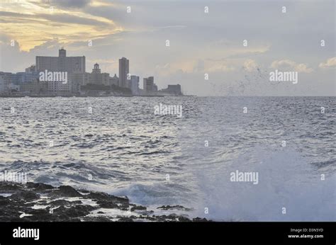 Waves Crashing Against The Wall In Malecon Havana Cuba Stock Photo