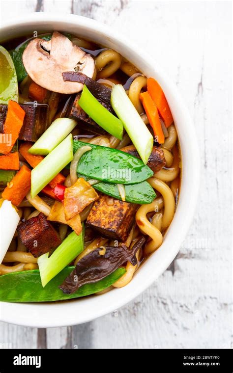 Bowl Of Japanese Miso Soup With Udon Noodles Tofu Sugar Snap Peas