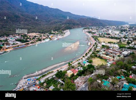 Aerial Drone Shot Over Ram Setu Jhula Suspension Bridge With Temples On