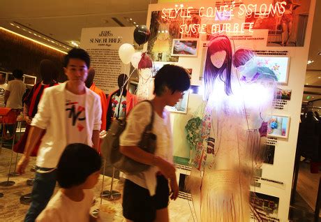 Shoppers Look Fashion Displays During Vogue Editorial Stock Photo