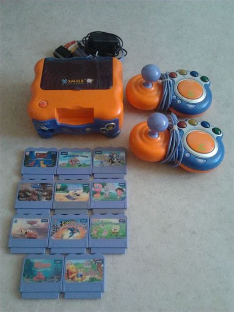 Vtech V.smile console with 11 games and 2 controllers - Catawiki