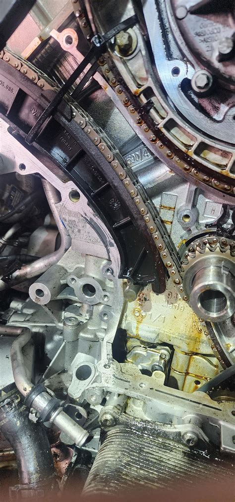 CS - Extremely large oil leak. Broken timing chain guide wore a hole on