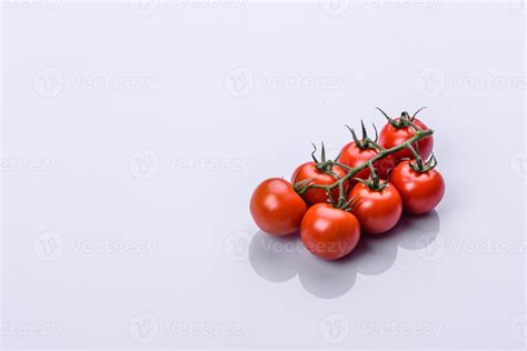 Bunch Of Fresh Red Tomatoes With Green Stems Isolated On White